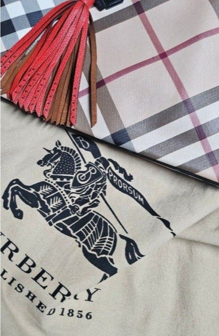 Burberry Check Tote Bag with Tassel (Category: Tote Bags) located in Quezon City. Submitted by kcobs (Listing ID 1465447362, Image 2). Description: - Authentic Burberry check canvas tote - Chic black patent leather handles - Eye-catching red leather tassel charm - Structured silhouette with protective metal feet - Includes original Burberry Prorsum knight logo dust bag - PM for more details or fast transactions! > FREE Coach leather tassel bag ch
