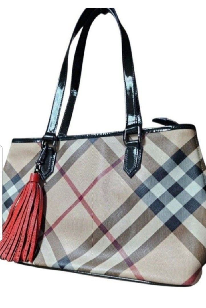 Burberry Check Tote Bag with Tassel (Category: Tote Bags) located in Quezon City. Submitted by kcobs (Listing ID 1465447362, Image 3). Description: - Authentic Burberry check canvas tote - Chic black patent leather handles - Eye-catching red leather tassel charm - Structured silhouette with protective metal feet - Includes original Burberry Prorsum knight logo dust bag - PM for more details or fast transactions! > FREE Coach leather tassel bag ch
