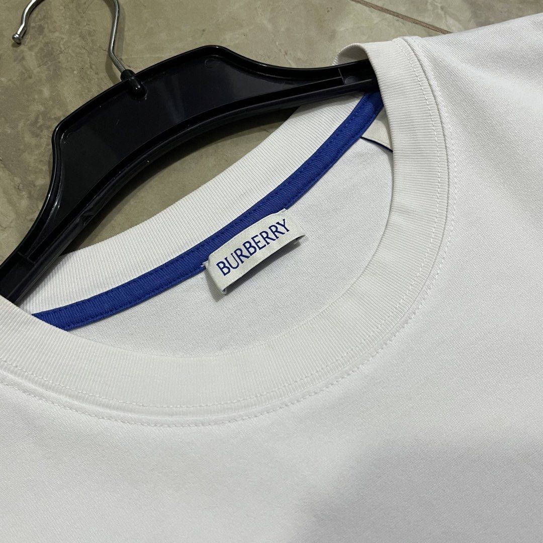 BURBERRY EMBROIDERED LOGO WHITE TSHIRT (Category: Luxury Apparel) located in Marikina City. Submitted by arniejane23 (Listing ID 1465515469, Image 3). Description: BURBERRY EMBROIDERED LOGO WHITE TSHIRT SIZE M ON TAG DIMENSION width - 20 length - 27 ISSUE DOT RUST STAINS SEE LAST PICTURE EXCELLENT CONDITION!! 📩📩📩.