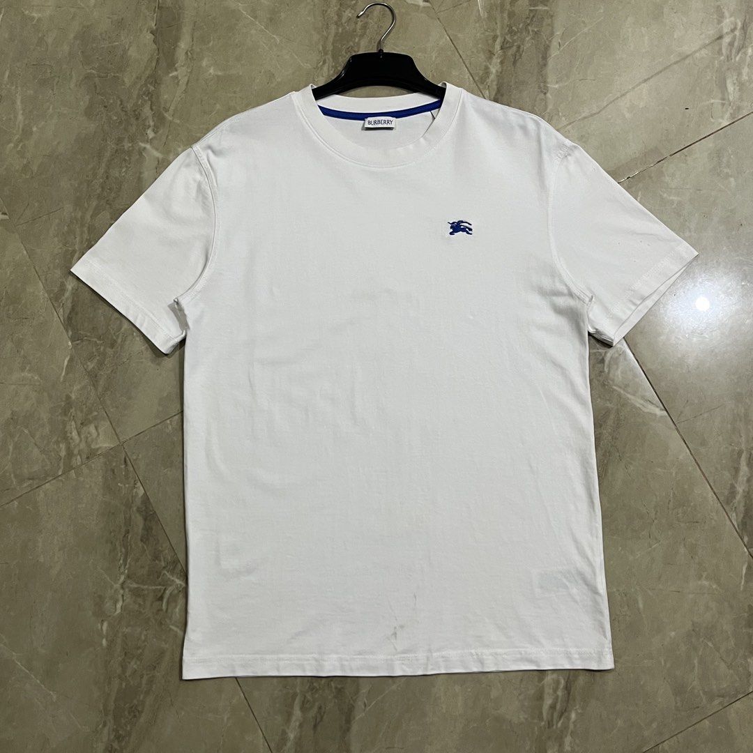 BURBERRY EMBROIDERED LOGO WHITE TSHIRT (Category: Luxury Apparel) located in Marikina City. Submitted by arniejane23 (Listing ID 1465515469, Image 1). Description: BURBERRY EMBROIDERED LOGO WHITE TSHIRT SIZE M ON TAG DIMENSION width - 20 length - 27 ISSUE DOT RUST STAINS SEE LAST PICTURE EXCELLENT CONDITION!! 📩📩📩.