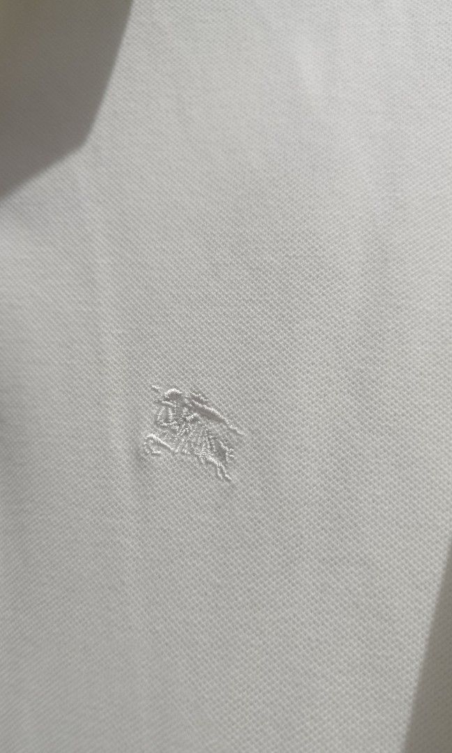 Burberry polo shirt as pack (Category: Tshirts & Polo Shirts ) located in Jaen. Submitted by vinzyrus217291 (Listing ID 1465445390, Image 3). Description: blue burberry polo - medium sized - no issues - metal buttons off white burberry polo - med to large size - no issues - Nueva ecija location 📍 can do meetups or shipping via jnt - unli VC and past transaction checking for assurance!!.