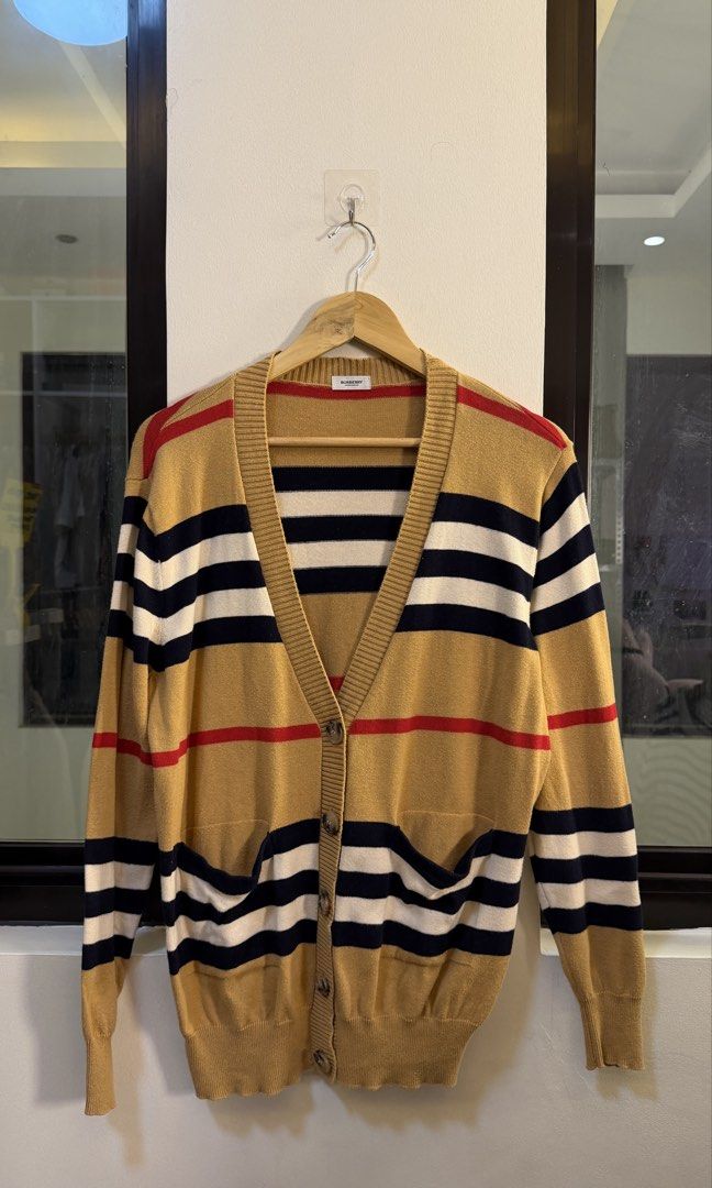 Burberry Striped Knit Cardigan (Category: Longsleeves) located in Paranaque City. Submitted by preluxeshop_ph (Listing ID 1465560842, Image 2). Description: Burberry Striped Knit Cardigan - Iconic stripe pattern - V-neck design - Button-up front - Two front pockets - Material: Cashmere, Polyester, Nylon blend - Ideal for layering 🔥CHECK OUT MY PROFILE FOR 100+ OTHER HIGH-END CURATED STREETWEAR, COATS AND VINTAGE DROPS!.
