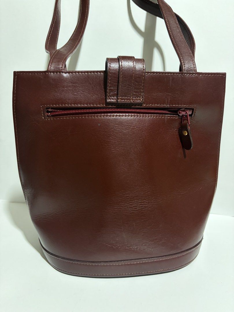 Burgundy Shoulder Bag (Category: Shoulder Bags) located in Quezon City. Submitted by wagwagan_ukay_blues (Listing ID 1465511045, Image 2). Description: From Japan In good condition Long strap Back zipper pocket Zipper pockets inside Signs of usage Still presentable L-9” W-7” H-10” Novaliches Qc.
