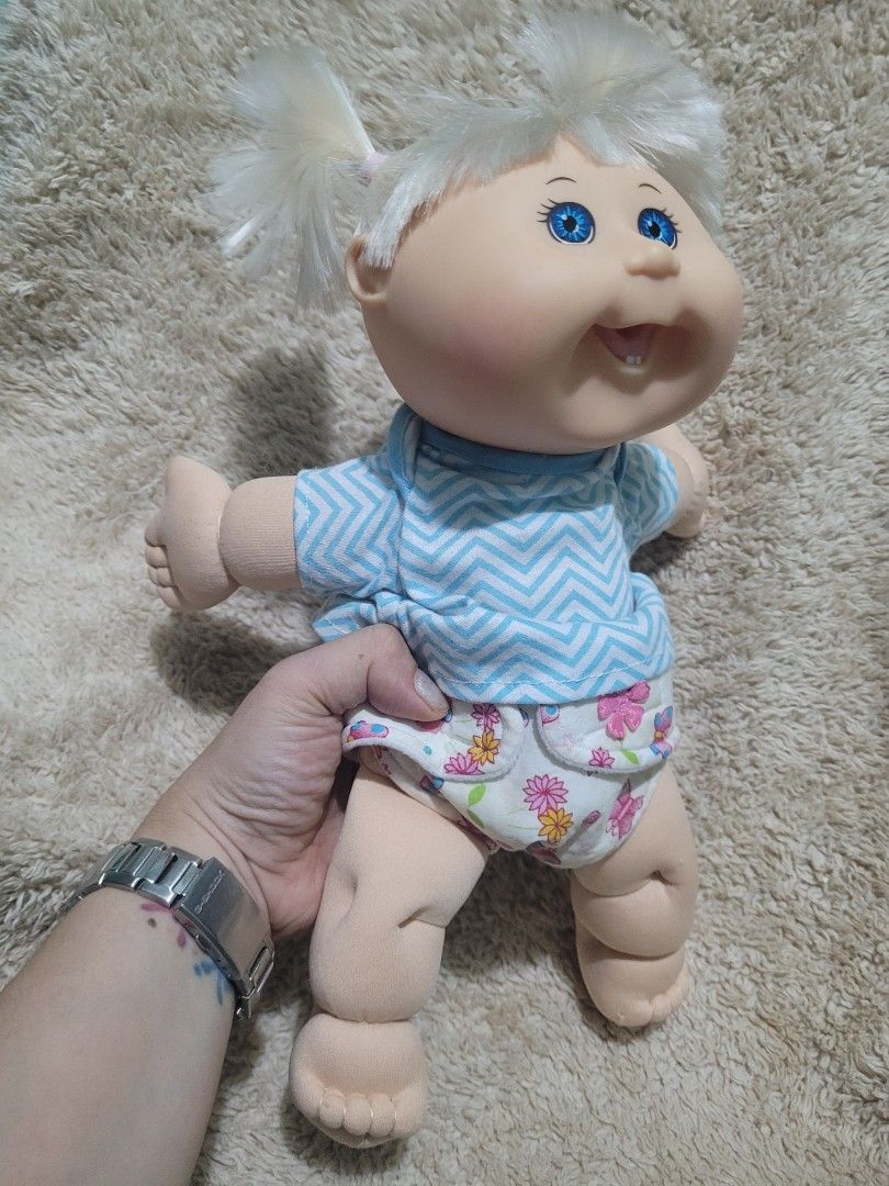 CABBAGE PATCH KIDS DOLL CPK FIRST TOOTH MOLD (W/ BODY STITCHES) (Category: Kids Toys) located in Makati City. Submitted by juriexpi (Listing ID 1465559249, Image 2). Description: CABBAGE PATCH KIDS DOLL CPK FIRST TOOTH MOLD (W/ BODY STITCHES) preloved doll with body stitches, very clean body, soft hair what you see is what you get orig CPK Authentic 2012 Cabbage Patch Kids doll by Jakks (OAA Inc stamped on head) - Features lovely white pigtails a