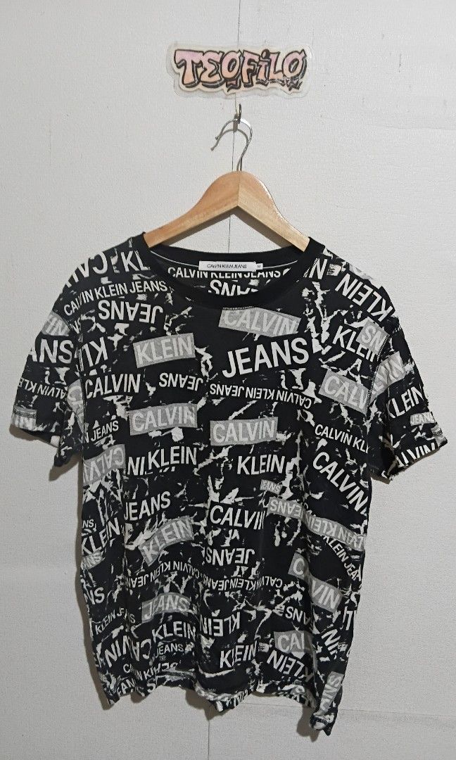 Calvin klein (Category: Tshirts & Polo Shirts ) located in Santo Tomas. Submitted by teofilo-thrifted (Listing ID 1465428495, Image 1). Description: Ck Aop Excellent Size medium on tag L26 W21.