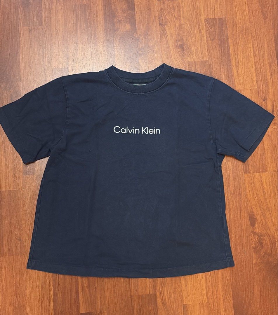 Calvin Klein Navy Blue T-Shirt (Category: Shirts) located in Silang. Submitted by collectionbyrk (Listing ID 1465520315, Image 1). Description: Original.