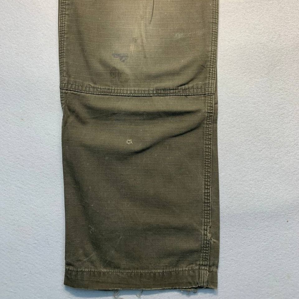Carhartt B342 DFE Cargo Relaxed Fit Pants (Category: Jeans) located in Mandaluyong City. Submitted by theroom501 (Listing ID 1465417667, Image 3). Description: Carhartt B342 DFE Cargo Relaxed Fit Pants Style Code: B342 DFE Size on Tag: 34 Color: Cream Condition: Good pre-owned condition with a heavily distressed vintage look. Flaws/Issues: Heavy distressing throughout the fabric faded paint stain. Flat Lay Measurements: Pit to Pit: 34 inches Leng