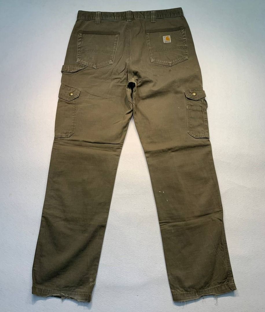 Carhartt B342 DFE Cargo Relaxed Fit Pants (Category: Jeans) located in Mandaluyong City. Submitted by theroom501 (Listing ID 1465417667, Image 1). Description: Carhartt B342 DFE Cargo Relaxed Fit Pants Style Code: B342 DFE Size on Tag: 34 Color: Cream Condition: Good pre-owned condition with a heavily distressed vintage look. Flaws/Issues: Heavy distressing throughout the fabric faded paint stain. Flat Lay Measurements: Pit to Pit: 34 inches Leng