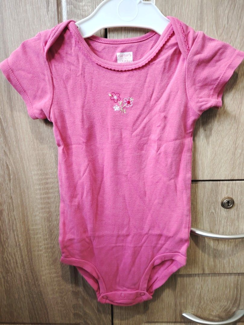 Carter's Baby Bodysuits Bundle 9-12 Months (Category: Babies & Kids Fashion) located in Malabon City. Submitted by jessa.sioson (Listing ID 1465528729, Image 1). Description: - Brand: Carter's - Quantity: Bundle of 3 baby bodysuits - Size: 9 to 12 months - Material: Super soft cotton - Features: Bottom snap button closures for quick and easy diaper changes - Designs included: * Plain pink short-sleeve with cute floral embroidery * Black and white