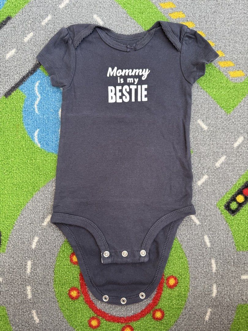 Carter’s Bodysuit Romper Onesie (Category: Babies & Kids Fashion) located in Rizal. Submitted by preloovved (Listing ID 1465495731, Image 1). Description: Super cute dark grey 'Mommy is my BESTIE' baby bodysuit in soft cotton. Features short flutter sleeves and bottom snaps for easy changes. Clean, smoke-free home. Standard infant size. Preloved, 6mos Meet-up only in GB1 San Mateo, Rizal Shipping fee c/o buyer. Tres Marias or J&T express Payment 