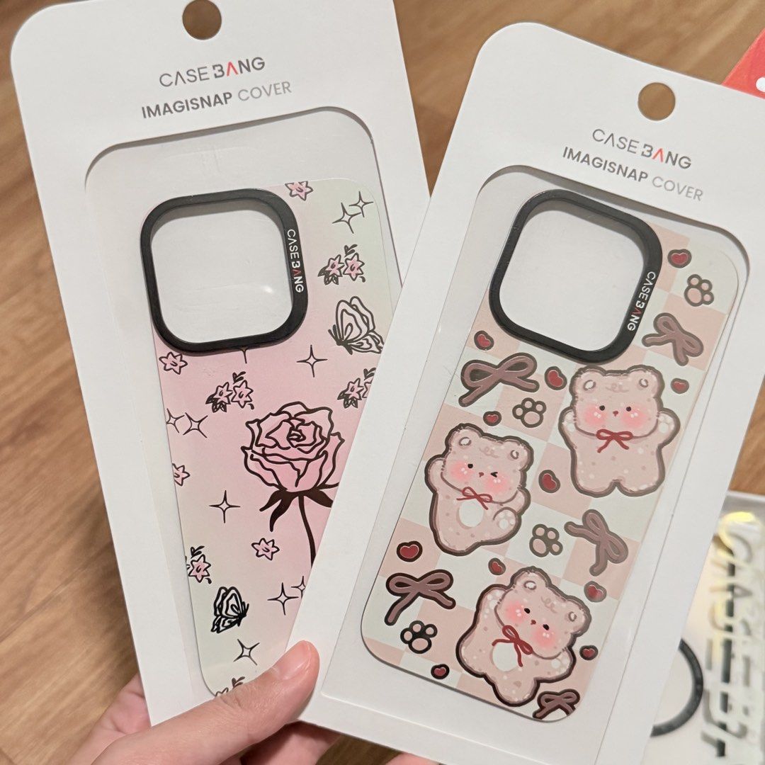 Casebang for Iphone 16 pro iphone case (Category: Cases & Sleeves) located in Paranaque City. Submitted by qwerein (Listing ID 1465498774, Image 2). Description: Brand: Casebang Imagisnap Cover - Compatibility: Specifically designed for iPhone 16 Pro - Features: MagSafe compatible options and interchangeable back cover designs - Styles Available: Pink rose floral pattern, cute teddy bear print, and sleek white MagSafe Rfs: too many cases na, decl