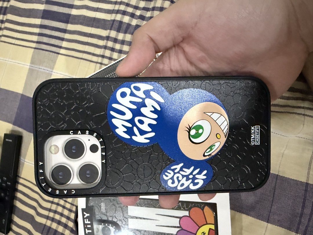 Casetify Murakami Iphone 14 pro max (Category: Cases & Sleeves) located in Manila. Submitted by sneakerfreaker0727 (Listing ID 1465545348, Image 2). Description: Casetify Takashi Murakami Collaboration For Iphone 14 pro max Flower Case has phone stand from HK casetify Dob case is regular matte case bought from casetify website 2.5k for flower case 2k for dob case Negotiable if as pack Rfs: changed phone.