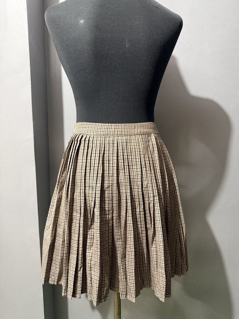 Celine Brown Houndstooth Pleated Wool Skirt Size 38 (Category: Skirts) located in Marikina City. Submitted by anndergroundmarket (Listing ID 1465431217, Image 2). Description: - Brand: Celine - Pattern & Color: Brown houndstooth - Material: 100% wool (heavyweight with soft texture) - Made in France - Size: 38 (tag attached) - Design: Classic structured waist with neat box pleats all around - Authenticity: Includes LVMH Fashion Group Japan import 