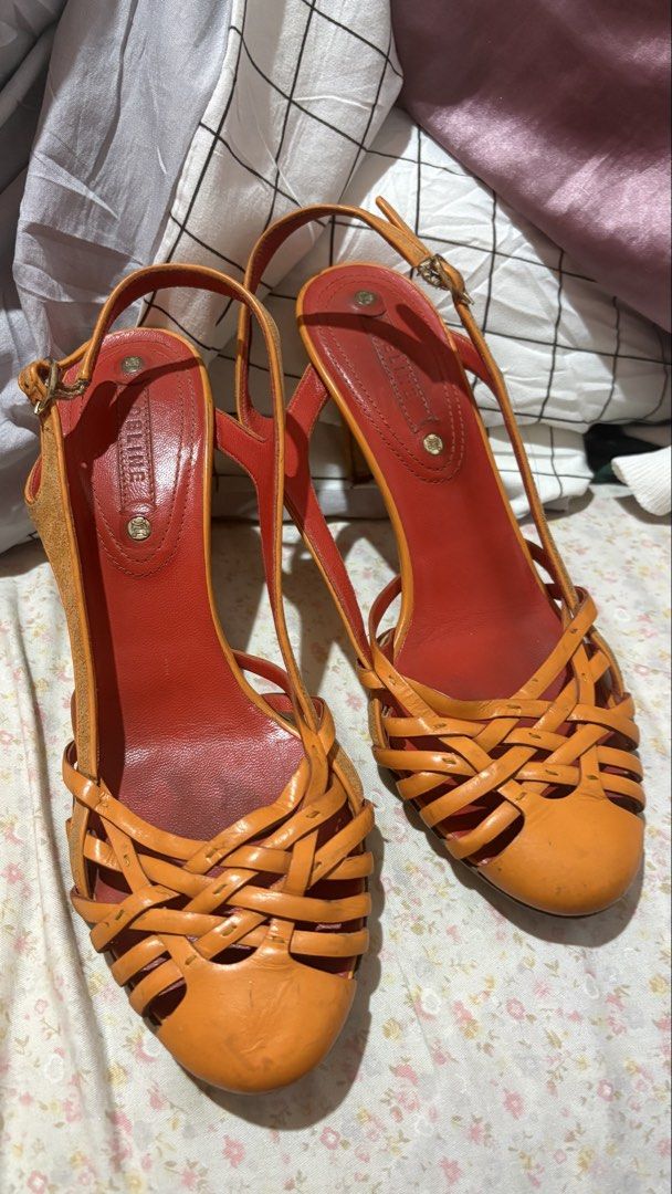 Celine Orange and Red Woven Leather Slingback Heels (Category: Heels) located in Davao. Submitted by sammyang123 (Listing ID 1465453055, Image 1). Description: Vintage Celine in Orange😭🫶🏻🍑🐅 PURE LEATHER VERY STURDY! Perfect for Summer⛱️ FREE SHIP Still in very great condiii - Style: Two-tone orange and red slingback heels - Materials: Woven leather front straps, suede-covered heels and side panels, leather lining and insoles - Features: Roun