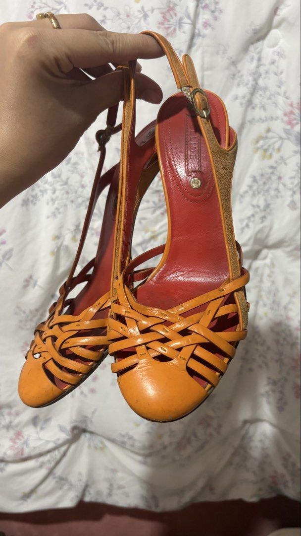 Celine Orange and Red Woven Leather Slingback Heels (Category: Heels) located in Davao. Submitted by sammyang123 (Listing ID 1465453055, Image 2). Description: Vintage Celine in Orange😭🫶🏻🍑🐅 PURE LEATHER VERY STURDY! Perfect for Summer⛱️ FREE SHIP Still in very great condiii - Style: Two-tone orange and red slingback heels - Materials: Woven leather front straps, suede-covered heels and side panels, leather lining and insoles - Features: Roun