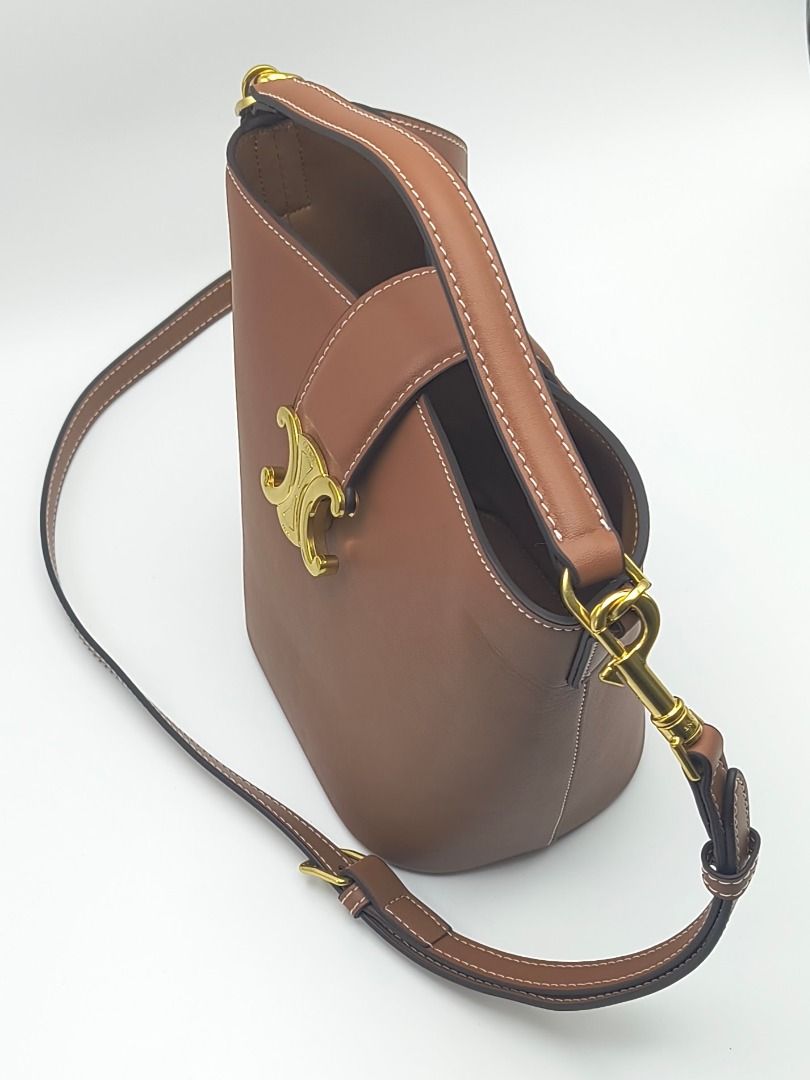 Celine Small Bucket Bag Louise Brown (Category: Luxury Bags & Wallets) located in Cebu City. Submitted by affordabagss (Listing ID 1465521233, Image 2). Description: Celine Small Bucket Louise crafted in smooth calfskin with signature gold-tone Triomphe hardware. Features a structured bucket silhouette with top handle and removable shoulder strap. Length: 16 cm Height: 19 cm Depth: 12 cm Colour: Brown Material(s): Smooth Calfskin Leather Hardware