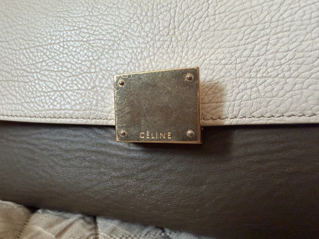 Celine Tricolor Trapeze Bag (Category: Luxury Bags & Wallets) located in Manila. Submitted by gcgarcia (Listing ID 1465416269, Image 2). Description: - Brand: Celine - Style: Trapeze Bag - Colorway: Tricolor (Olive Green, White, Dark Blue) - Features: Structured top handle, detachable shoulder strap - Hardware: Gold-tone with Celine logo stamps (clasp, zipper pulls, strap clasps) - Interior: Gold embossed Celine Paris Made in Italy stamp near the