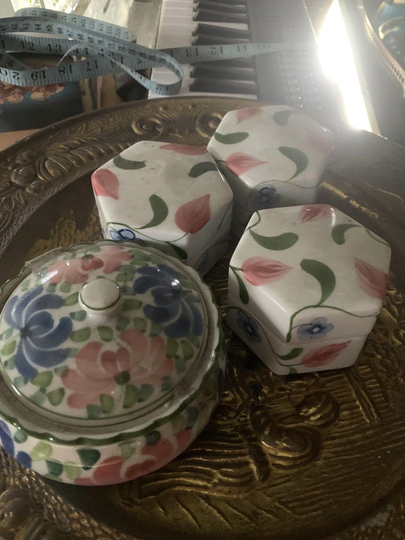 Ceramic floral trinket boxes and round lidded jar set (Category: Vases & Decorative Bowls) located in Quezon City. Submitted by sojisup (Listing ID 1465489716, Image 1). Description: - Set of 4 hand-finished ceramic decorative pieces - Includes 3 hexagonal trinket boxes with pink tulip and green leaf patterns - Includes 1 round lidded jar with blue and pink floral motifs - Great for organizing small accessories, jewelry, or desk items - Adds a ch