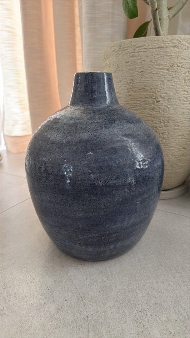 Ceramic Vases Home Decor Set (Category: Vases & Decorative Bowls) located in Manila. Submitted by pinklilo (Listing ID 1465466810, Image 1). Description: - Set of 2 decorative ceramic vases - Round blue vase with a unique textured finish - Cylindrical green vase with modern vertical grooves - Heavy, premium pottery material - Neutral tones that easily match any modern living space - Ideal as table or shelf centerpieces.