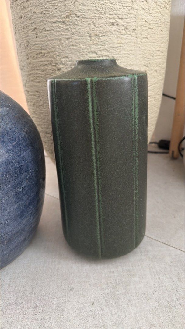 Ceramic Vases Home Decor Set (Category: Vases & Decorative Bowls) located in Manila. Submitted by pinklilo (Listing ID 1465466810, Image 2). Description: - Set of 2 decorative ceramic vases - Round blue vase with a unique textured finish - Cylindrical green vase with modern vertical grooves - Heavy, premium pottery material - Neutral tones that easily match any modern living space - Ideal as table or shelf centerpieces.