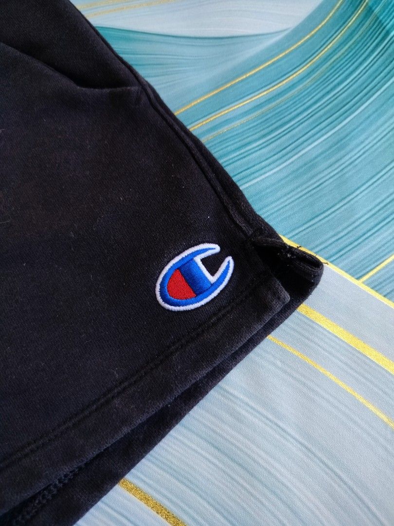Champion Black Drawstring Shorts XS (Category: Shorts) located in Manila. Submitted by gerald_quinto (Listing ID 1465481997, Image 2). Description: - Brand: Champion - Color: Classic Black - Size: XS -Size 28-30 - Material: Soft cotton blend (Made in Cambodia) - Features: Adjustable drawstring waist with black cords, side pockets, and iconic embroidered logo patch on the left leg - Condition/Use: Great for lounging or workouts - Fast shipping and