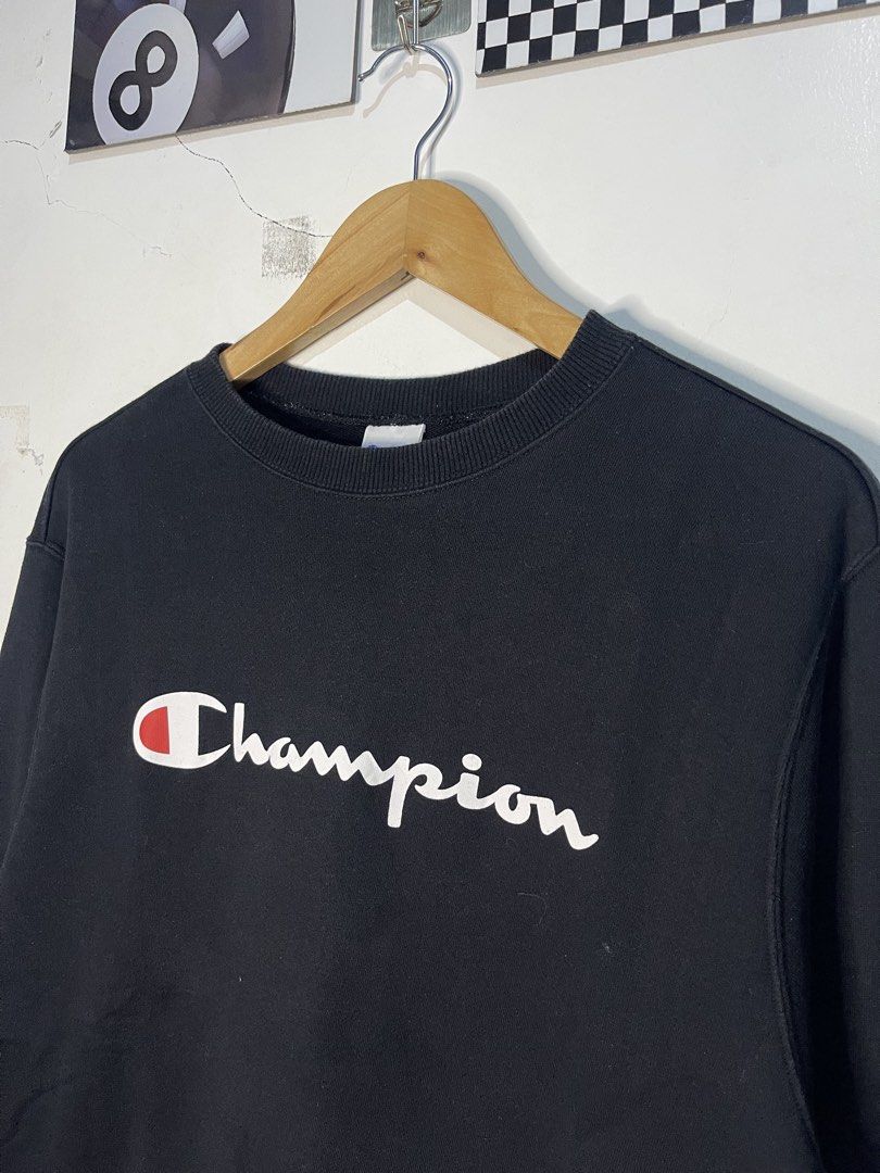 Champion Black Script Logo Sweatshirt X-Large (Category: Coats, Jackets and Outerwear) located in Cabagan. Submitted by blessingma81004 (Listing ID 1465429277, Image 3). Description: - Brand: Champion (Model: C3-Q002) - Color: Black with white/red script logo - Size: Tagged XL, fits closer to a Large - Details: Small embroidered Champion patch on left sleeve, ribbed cuffs and hem - Material: Comfortable cotton body - Origin: Made in Cambodia - Co