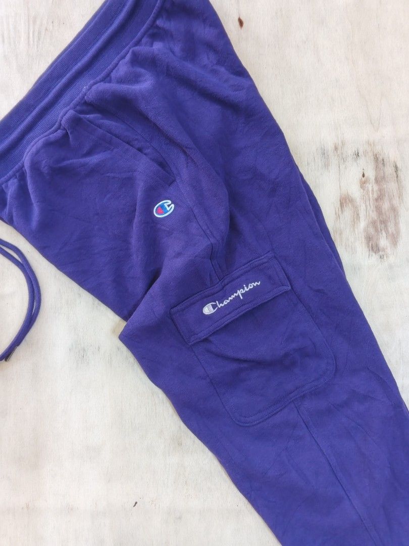 Champion Purple Cargo Sweatpants with Side Pockets (Category: Joggers) located in Cavite. Submitted by kurthriftz23 (Listing ID 1465402527, Image 2). Description: SALE! CHAMPION JOGGER PANTS ACTUAL COLOR: PURPLE COLOR MAY VARY DUE TO LIGHTING IN GOOD CONDITION (LIKE NEW) SIZE: MEDIUM (ON TAG) NO ISSUE! CRISPY UNISEX! 559 + SF DM FOR MORE DETAILS 📩.