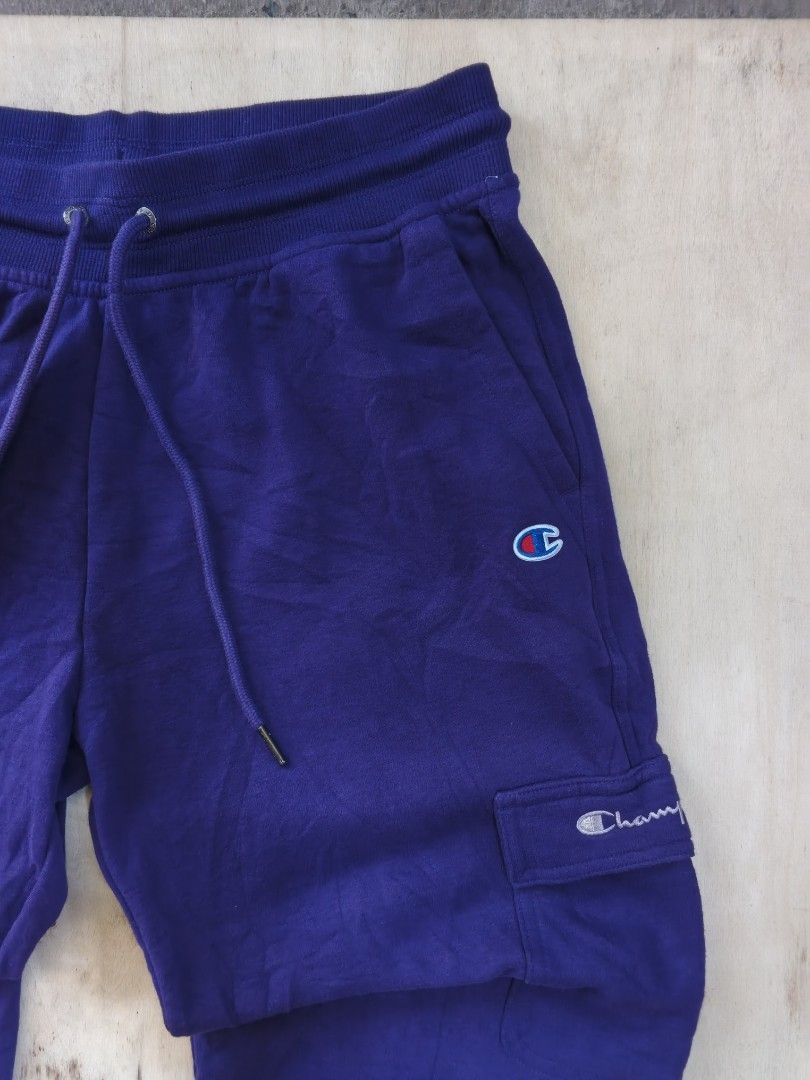 Champion Purple Cargo Sweatpants with Side Pockets (Category: Joggers) located in Cavite. Submitted by kurthriftz23 (Listing ID 1465402527, Image 3). Description: SALE! CHAMPION JOGGER PANTS ACTUAL COLOR: PURPLE COLOR MAY VARY DUE TO LIGHTING IN GOOD CONDITION (LIKE NEW) SIZE: MEDIUM (ON TAG) NO ISSUE! CRISPY UNISEX! 559 + SF DM FOR MORE DETAILS 📩.