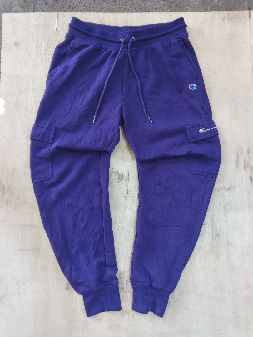 Champion Purple Cargo Sweatpants with Side Pockets (Category: Joggers) located in Cavite. Submitted by kurthriftz23 (Listing ID 1465402527, Image 1). Description: SALE! CHAMPION JOGGER PANTS ACTUAL COLOR: PURPLE COLOR MAY VARY DUE TO LIGHTING IN GOOD CONDITION (LIKE NEW) SIZE: MEDIUM (ON TAG) NO ISSUE! CRISPY UNISEX! 559 + SF DM FOR MORE DETAILS 📩.