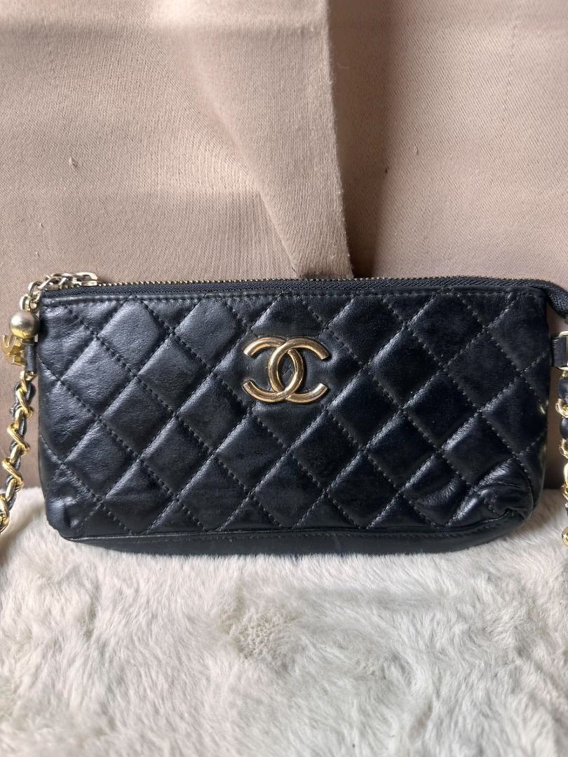 Chanel Black Quilted Leather Shoulder Bag (Category: Luxury Bags & Wallets) located in Davao. Submitted by luckyturtle.aa6ccf (Listing ID 1465392589, Image 2). Description: - Style: Compact crossbody or shoulder bag - Exterior: Premium black quilted leather with gold-tone hardware - Strap: Gold chain interwoven with black leather - Closure: Top zipper with a chic gold Chanel logo charm - Interior: Black fabric lining with a convenient zippered po