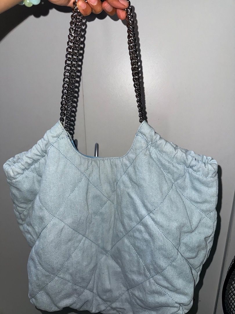 Charles & Keith Quilted Denim Shoulder Bag (Category: Shoulder Bags) located in Manila. Submitted by _outofthecloset. (Listing ID 1465421218, Image 1). Description: - Brand: Charles & Keith - Color/Material: Light blue quilted denim - Strap: Silver chain strap - Closure: Secure magnetic snap closure - Interior: Fabric lining with 1 zip pocket and 1 slip pocket - Authenticity: Inner brand tag and care label intact - Condition/Use: Spacious everyda