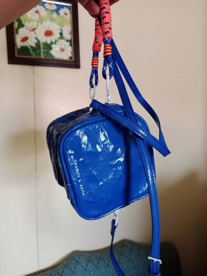 Charles and Keith nano bag (Category: Cross-body Bags) located in Angeles City. Submitted by mjshoppingretail (Listing ID 1465410190, Image 3). Description: Charles Keith nano bag.