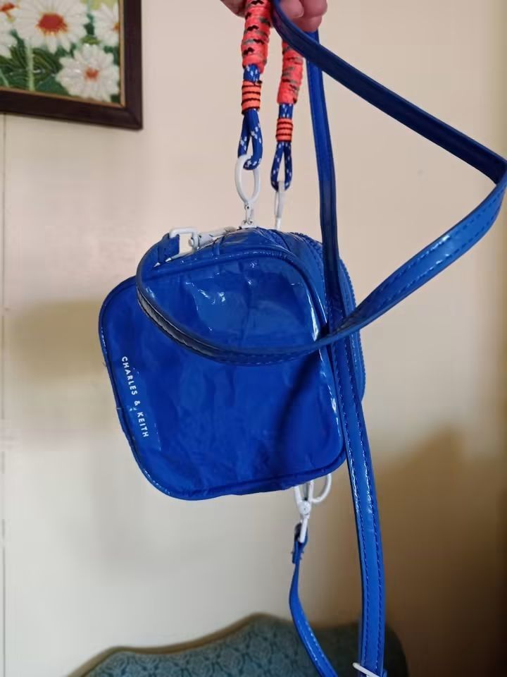 Charles and Keith nano bag (Category: Cross-body Bags) located in Angeles City. Submitted by mjshoppingretail (Listing ID 1465410190, Image 2). Description: Charles Keith nano bag.