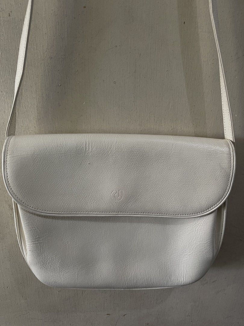 Charles Jourdan Paris White Leather Shoulder Bag (Category: Shoulder Bags) located in Quezon City. Submitted by akismurabels (Listing ID 1465398678, Image 3). Description: AUTHENTIC CHARLES JOURDAN BRAND Size: L:24cm H:20cm W:5cm MOP: Gcash MOD:Lalamove or LBC LOC: Quezon City Visayas avenue - Brand: Charles Jourdan Paris - Material: Premium white leather - Closure: Flap front with secure magnetic clasp and embossed logo - Hardware: Elegant gold-