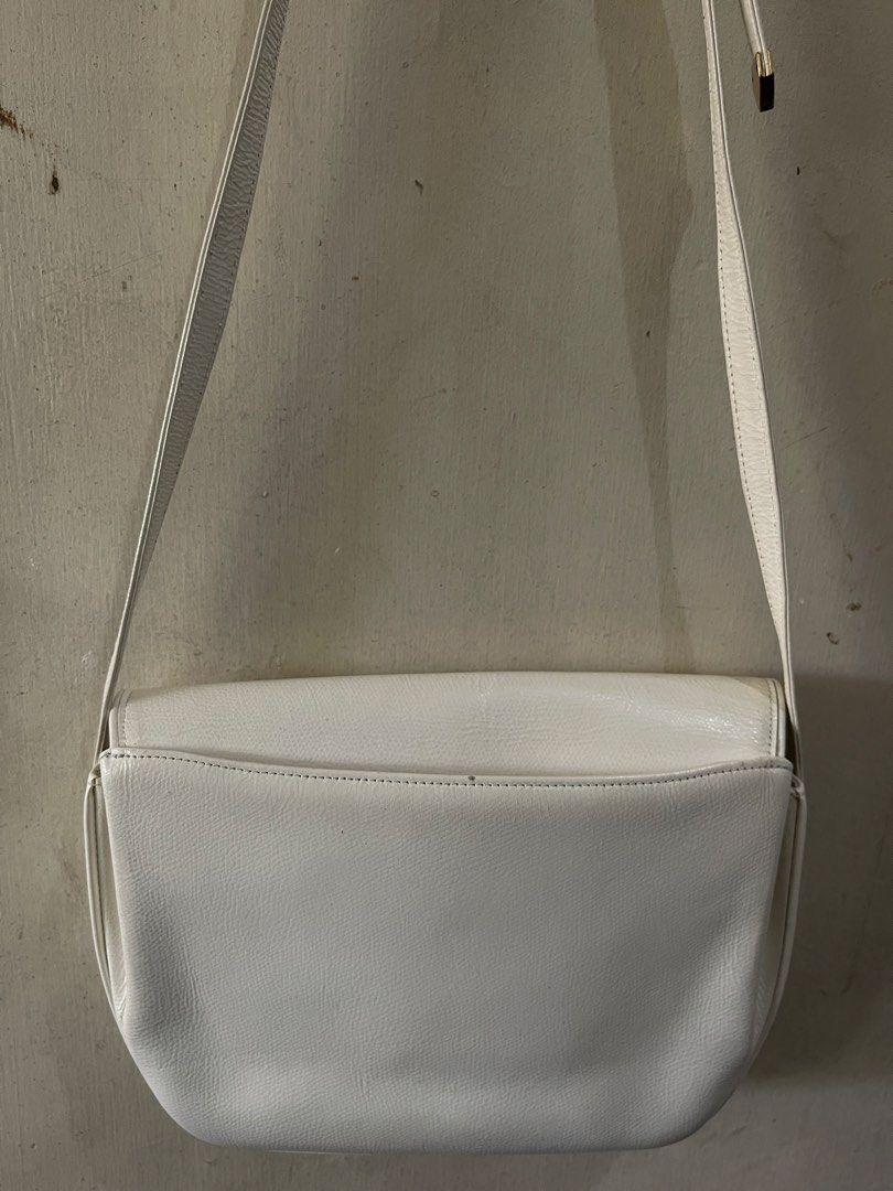 Charles Jourdan Paris White Leather Shoulder Bag (Category: Shoulder Bags) located in Quezon City. Submitted by akismurabels (Listing ID 1465398678, Image 2). Description: AUTHENTIC CHARLES JOURDAN BRAND Size: L:24cm H:20cm W:5cm MOP: Gcash MOD:Lalamove or LBC LOC: Quezon City Visayas avenue - Brand: Charles Jourdan Paris - Material: Premium white leather - Closure: Flap front with secure magnetic clasp and embossed logo - Hardware: Elegant gold-