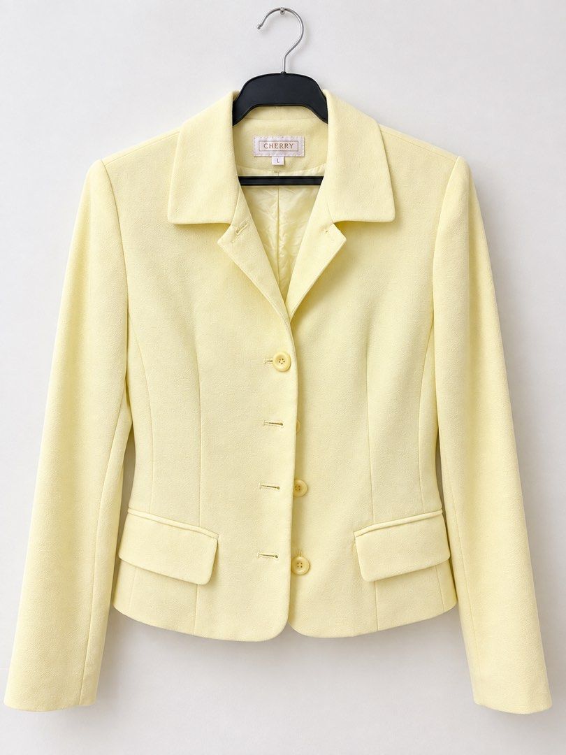 CHERRY Yellow Long Sleeve Button Blazer Jacket (Category: Coats, Jackets and Outerwear) located in Malabon City. Submitted by ynaboomboom (Listing ID 1465533123, Image 1). Description: - Brand: CHERRY - Size: best fit Medium - Color: Bright pastel yellow - Style: Structured lapels with four front buttons - Pockets: Two functional waist flap pockets - Lining: Fully lined interior - Occasion: Ideal for workwear or smart casual outfits.