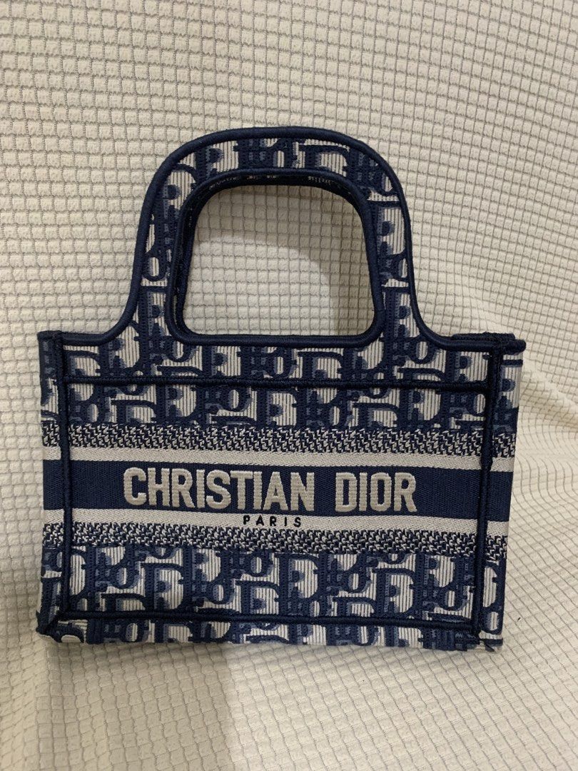 Christian Dior MINI book tote (Category: Luxury Bags & Wallets) located in Surigao. Submitted by luxxbytm.ph (Listing ID 1465457168, Image 1). Description: excellent condition .