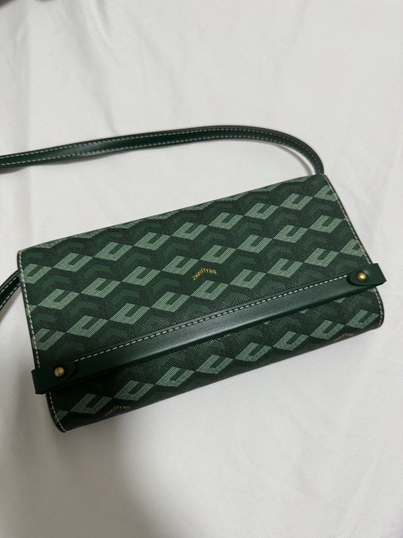 Christy Ng Diego (Category: Cross-body Bags) located in Manila. Submitted by summer.731 (Listing ID 1465444839, Image 1). Description: - Brand: Christy Ng - Style: Crossbody bag with a trendy geometric pattern - Details: Dark green leather trim, white contrast stitching, and premium gold hardware - Closure: Secure flap with a magnetic snap - Interior: Clean lining with a convenient zippered pocket - Condition: Well-maintained and ready to use.