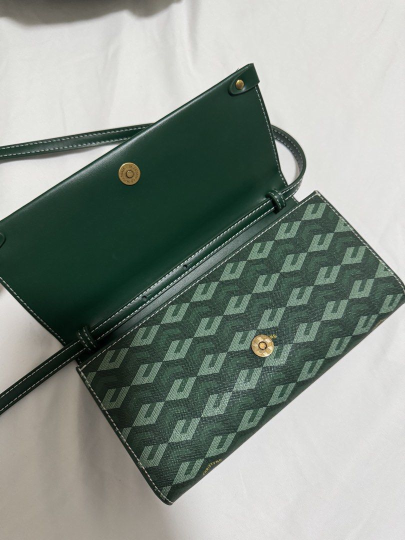 Christy Ng Diego (Category: Cross-body Bags) located in Manila. Submitted by summer.731 (Listing ID 1465444839, Image 2). Description: - Brand: Christy Ng - Style: Crossbody bag with a trendy geometric pattern - Details: Dark green leather trim, white contrast stitching, and premium gold hardware - Closure: Secure flap with a magnetic snap - Interior: Clean lining with a convenient zippered pocket - Condition: Well-maintained and ready to use.