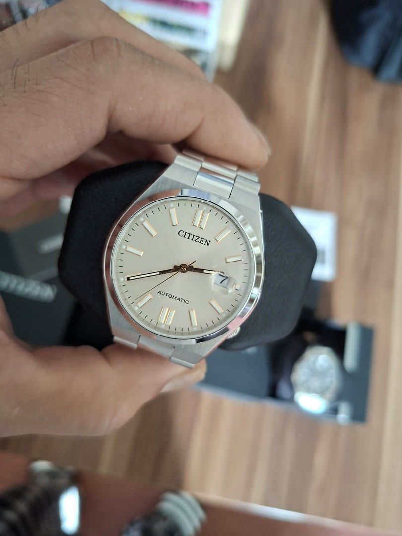 Citizen Tsuyosa Automatic Watch Beige Dial (Category: Men's Watches) located in Valenzuela. Submitted by piayap14 (Listing ID 1465505114, Image 2). Description: - Model: Citizen Tsuyosa Automatic Watch - Dial: Champagne sunburst dial with elegant gold indices - Crystal: Clean crystal featuring a date window at 3 o'clock with a cyclops magnifier - Case & Bracelet: Polished stainless steel case with a matching integrated bracelet and signed folding