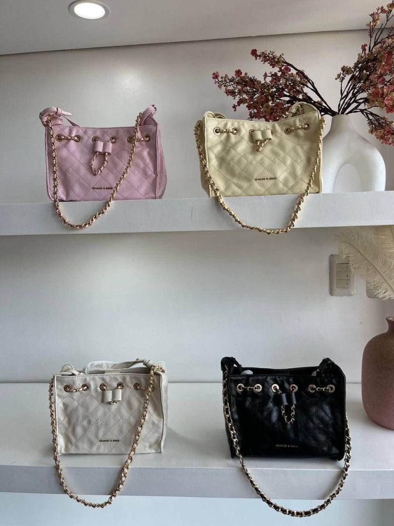 C&K Hobo Bag (Category: Shoulder Bags) located in Manila. Submitted by liahsells (Listing ID 1465459058, Image 1). Description: - Stylish quilted design with structured base - Elegant gold-tone chain handles and hardware - Secure drawstring top closure - Spacious everyday size that easily fits your daily essentials - Available in 4 gorgeous colors: pink, cream, black, and white.