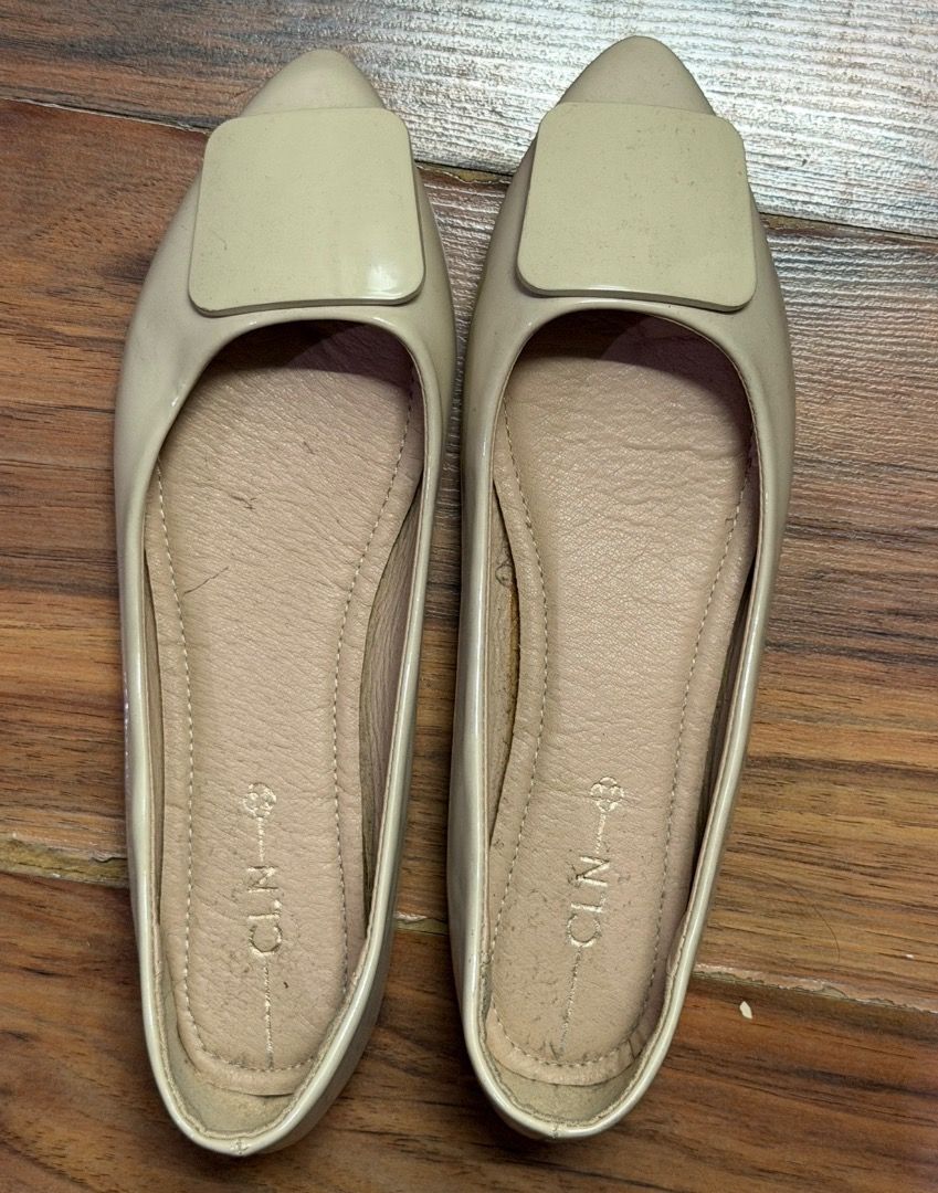 CLN Beige Pointed Toe Flats with Buckle Size 39 (Category: Flats & Sandals) located in Santa Rosa. Submitted by biancamarie0404 (Listing ID 1465434511, Image 1). Description: - Brand: CLN - Style: Pointed toe flats with large square buckle - Color: Beige patent with light pink interior lining - Size: 39 - Features: Cushioned insoles and good grip pattern on soles - Condition: Clean uppers, minor wear on insoles from previous fitting.