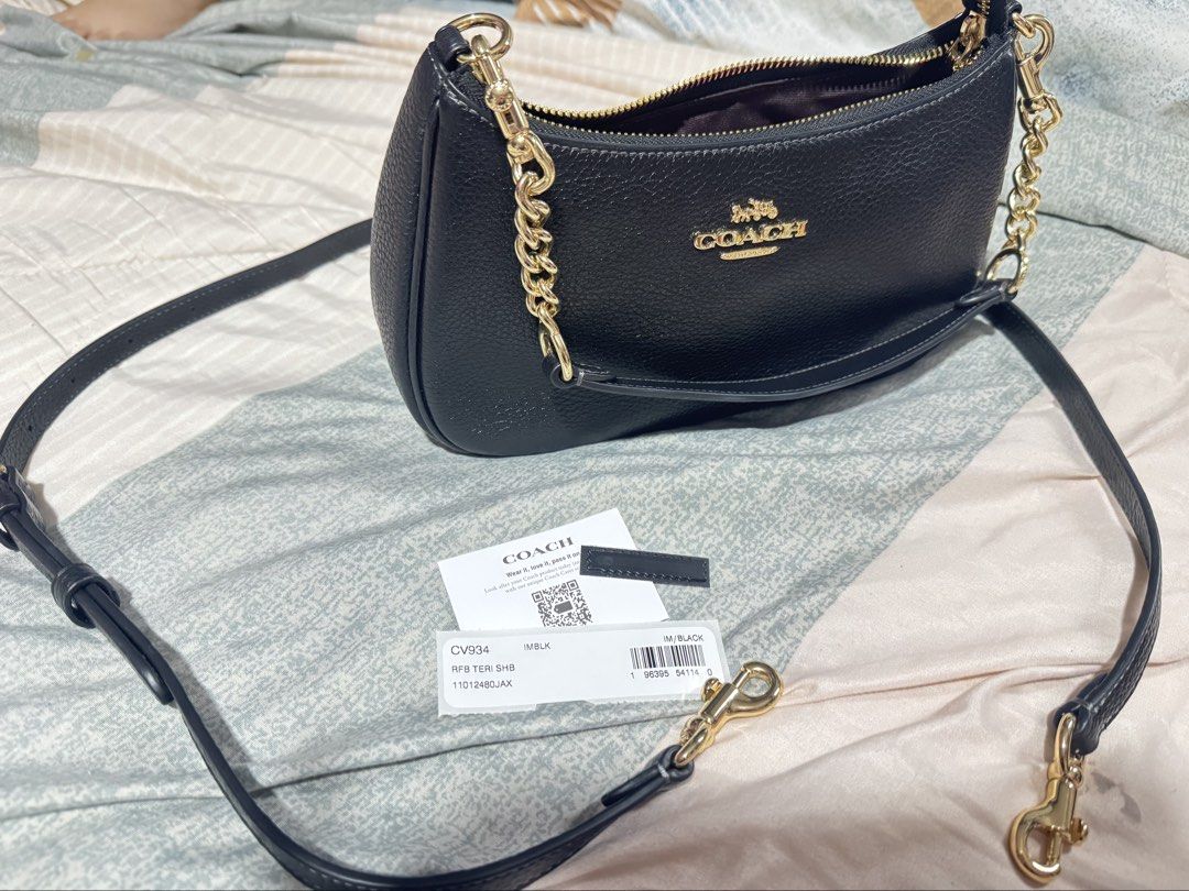 Coach black teri shoulder bag with long strap (Category: Shoulder Bags) located in Manila. Submitted by iamsassycl95926 (Listing ID 1465458687, Image 2). Description: Selling my preloved original coach teri fron SG used once good as new with complete set like care card and tag .