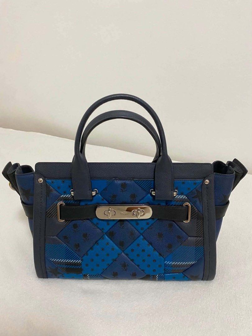 Coach Blue Patchwork Leather Satchel Bag (Category: Luxury Bags & Wallets) located in Pasig City. Submitted by preloved.by.patsy (Listing ID 1465479115, Image 1). Description: - Comes with receipt and authenticity card - Brand: Coach Satchel - Color: Dark blue tones with a mixed patchwork pattern (floral, polka dots, checks) - Features: Double top handles, adjustable/detachable shoulder strap, and front flap turnlock closure - Hardware & Accents: