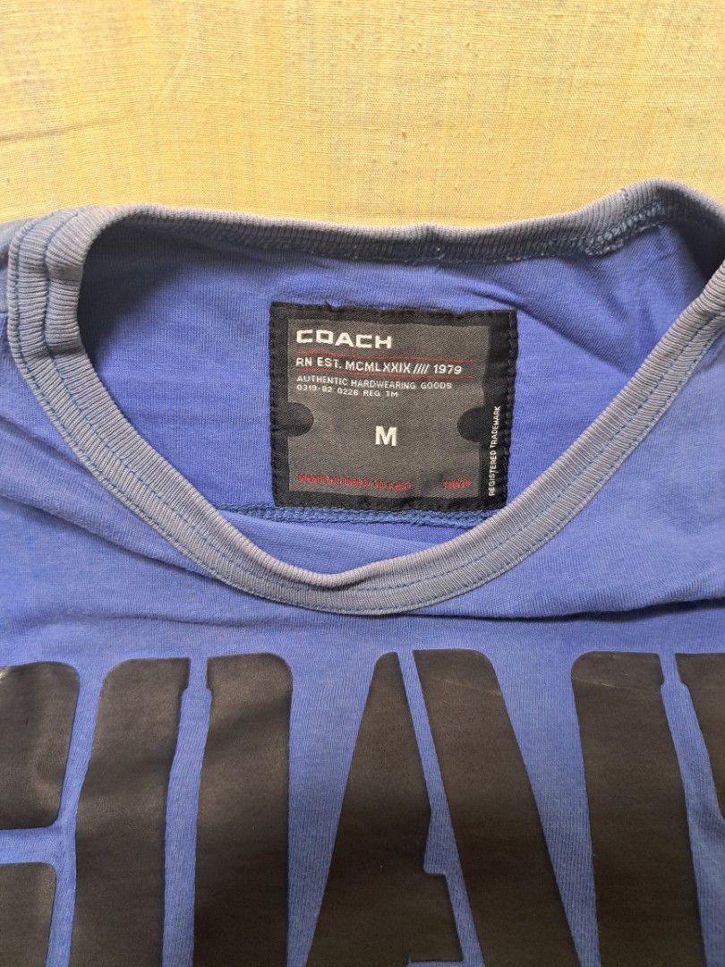 Coach Jeans Blue T-shirt Size M (Category: Shirts) located in Manila. Submitted by sainty.exe (Listing ID 1465455457, Image 2). Description: - Brand: Coach Jeans - Color: Blue - Size: Medium (Tag attached) - Material: Soft cotton - Design: 'Coach Jeans Since 1979' front graphic, number 8 back print - Details: Crew neck with ribbed collar, contrasting shoulder and side panels - Condition: Brand new with tag / Excellent pre-loved (Ready to wear).
