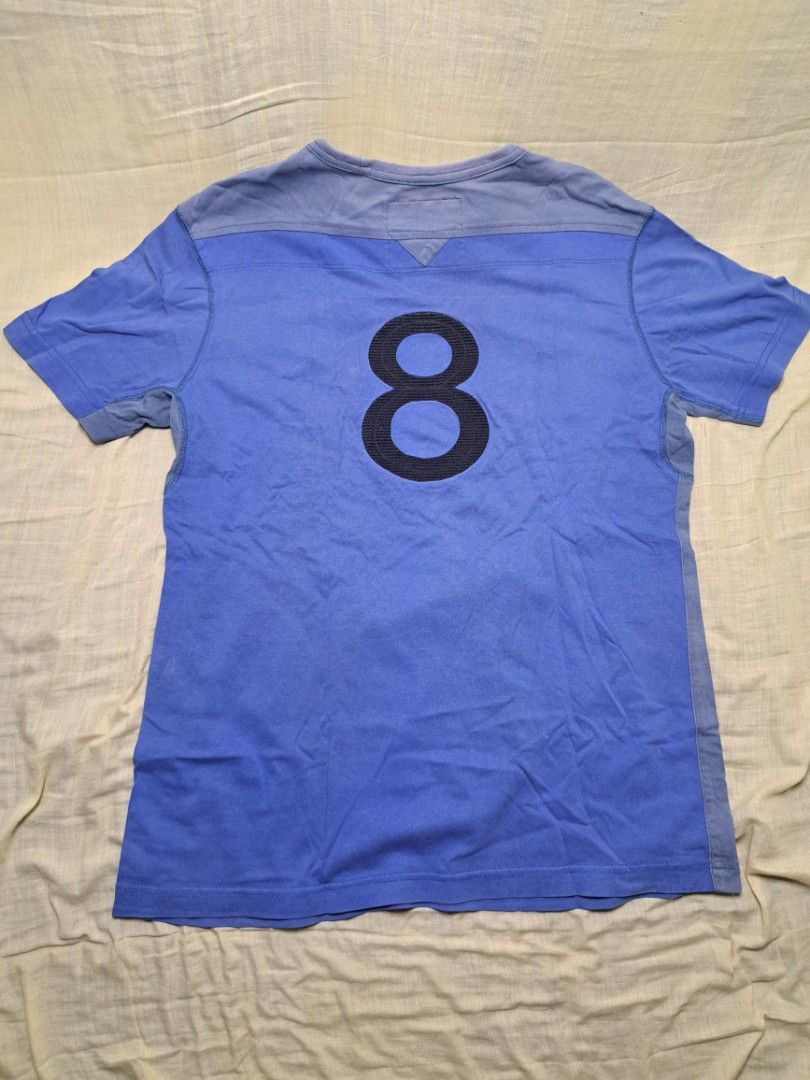 Coach Jeans Blue T-shirt Size M (Category: Shirts) located in Manila. Submitted by sainty.exe (Listing ID 1465455457, Image 3). Description: - Brand: Coach Jeans - Color: Blue - Size: Medium (Tag attached) - Material: Soft cotton - Design: 'Coach Jeans Since 1979' front graphic, number 8 back print - Details: Crew neck with ribbed collar, contrasting shoulder and side panels - Condition: Brand new with tag / Excellent pre-loved (Ready to wear).
