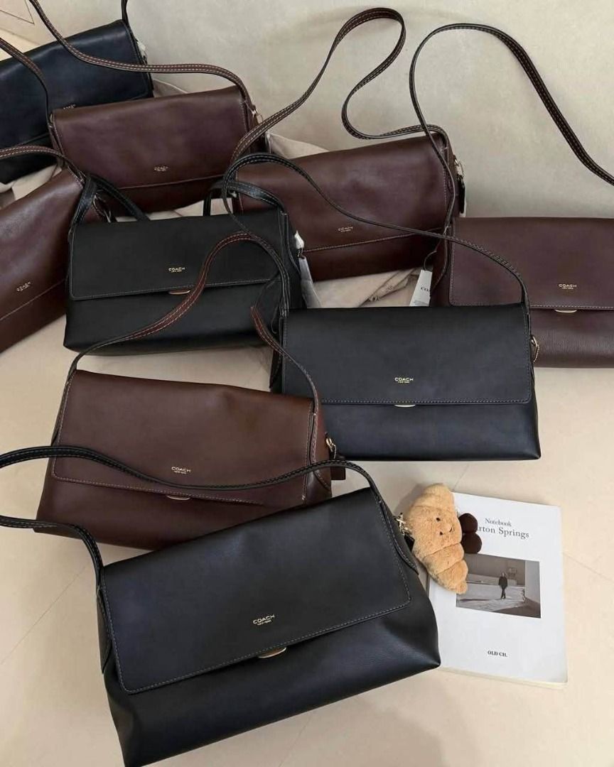 Coach Leather Flap Shoulder Bag Black and Brown (Category: Shoulder Bags) located in Manila. Submitted by liahsells (Listing ID 1465462184, Image 2). Description: - Brand: Coach - Material: Smooth leather with contrast stitching - Available in 30cm and 35 CM - Design: Structured flap with secure magnetic closure and gold-tone logo lettering - Straps: Long and adjustable for shoulder or crossbody wear - Interior: Clean lining with multiple pieces 