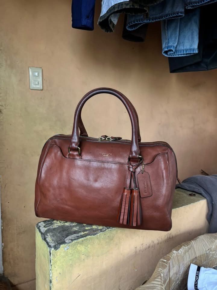 COACH LEGACY HALEY SATCHEL (Category: Luxury Bags & Wallets) located in Paranaque City. Submitted by glendalecollection (Listing ID 1465423902, Image 1). Description: This authentic Coach purse is made of leather and features: Dual rolled leather handles with 6” drop. Gold tone hardware. Custom twill lining. One inside zipper and two inside slip pockets. Light marks throughout exterior. .
