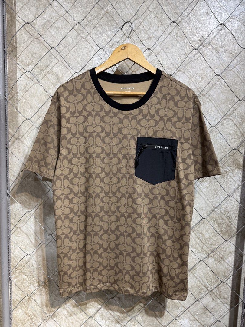 Coach Monogram Brown Pocket Tee. (Category: Tshirts & Polo Shirts ) located in Manila. Submitted by ardobe.mnl (Listing ID 1465534244, Image 1). Description: Size: Large Dimes: 21x27.5 Condition: Excellent Flaw: None! Dm for inquiries! 📥.