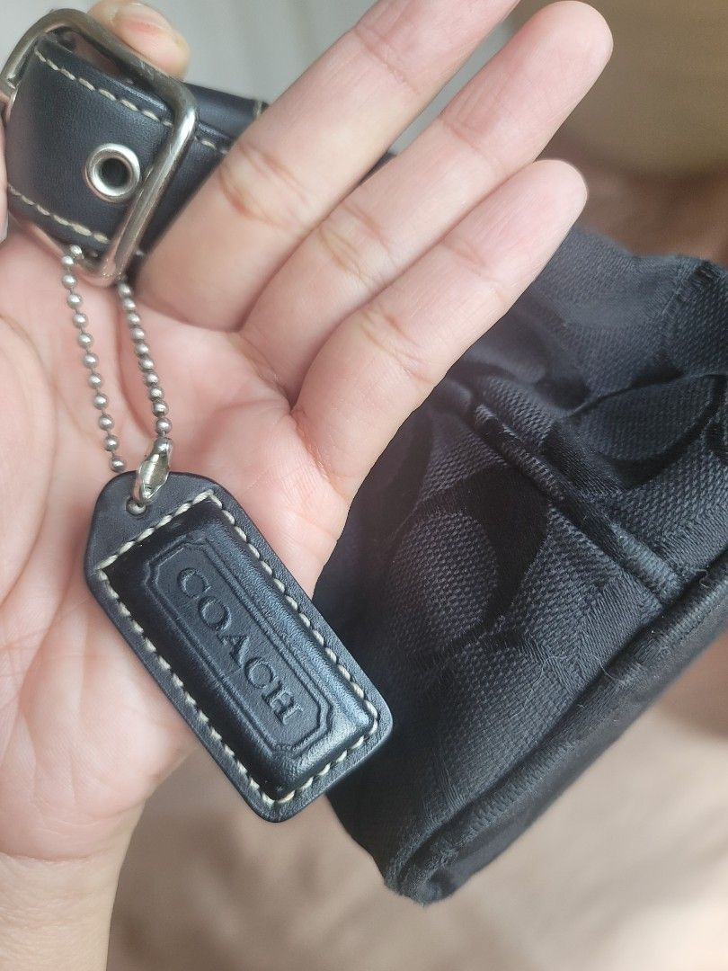 Coach Signature Black Monogram Small Shoulder Bag (Category: Luxury Bags & Wallets) located in Manila. Submitted by kamilleale02863 (Listing ID 1465460834, Image 3). Description: - Authentic Coach black shoulder bag with classic signature monogram pattern - Compact and practical size, ideal for daily essentials like phone, keys, and wallet - Secure top-zip closure to keep your belongings safe - Durable leather strap accented with polished silver 